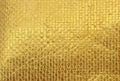 Close-up gold background, gold cloth. Background for photos, postcards, business cards.