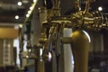 Close-up of golden beer taps Royalty Free Stock Photo