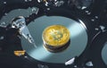 Golden bitcoin place on the hard drive platter Royalty Free Stock Photo