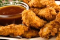 Close-up of golden brown fried chicken tenders with ketchup and honey mustard dipping sauce Royalty Free Stock Photo