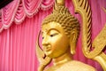 Close-up of a golden Buddha head statue