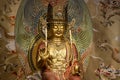 Golden Buddha statue inside the Buddha Tooth Relic Temple in Chinatown District, Singapore Royalty Free Stock Photo