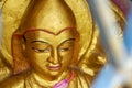 Close up from a golden Buddhist statue Royalty Free Stock Photo