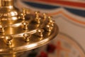 Close-up of golden church candlestick for many candles