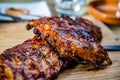 Close up of golden colored juicy roasted spare ribs on a wooden