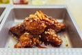 Close-up Golden Crunchy Korean Fried Chicken basic Huraideu-Chikin mix with spicy sauce and garlic.