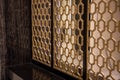 Close-up of a golden design fence. room partition.