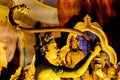 Close up of golden holy hindu statue inside batu caves in kuala lumpur, malaysia