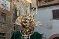 Close up of golden mask at the carnival of Castiglion FIbocchi