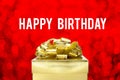 Close up Golden present with big bow and Happy Birthday word at Royalty Free Stock Photo