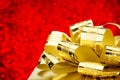 Close up Golden present box with big bow at bokeh white blur background, Leave space on top to adding your content. Royalty Free Stock Photo