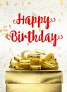 Close up Golden present box with Happy Birthday word and confetti blur background Royalty Free Stock Photo