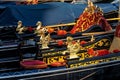 Close up of golden seahorses details on a gondola in Venice, Italy