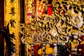 Close up of golden shields and chinese symbols in the buddism temple of literature. Hanoi, Vietnam - 04/02/2020