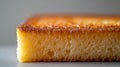 Close-up of a golden sponge cake slice showcasing texture. Royalty Free Stock Photo