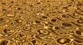 Close-up of a golden textured surface with irregular circles creating a shimmering metallic pattern with depth and dimension for Royalty Free Stock Photo