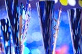 Close-up of golden trophies lined up at a dance event. Collection of trophies. Award cups close up