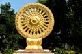 Close up Golden Wheel of Dhamma or Wheel of life and symbol teaching of the Lord Buddha, Symbol of Buddhism in the temple,