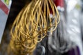 Close up of golden wire whisks hanging on store display Royalty Free Stock Photo