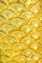 Golden yellow serpent scale statue texture with seamless patterns for background Royalty Free Stock Photo