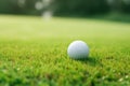 Close up golf ball blurred green grass hobby lawn leisure nature play recreation tee sport white field activity club Royalty Free Stock Photo