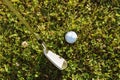 Close-up of golf ball with golf club before tee off Royalty Free Stock Photo