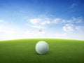 Close up golf ball on green grass field and red golf flag on green fairway with beautiful blue sky Royalty Free Stock Photo