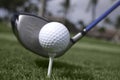 Close up of golf ball on tee and driver set up Royalty Free Stock Photo