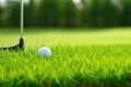 close-up of golf clubs and a ball on green grass Royalty Free Stock Photo