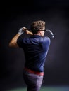 Close-up of a golf player intent on perfecting the swing