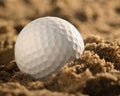 Close-up of golfball in sand Royalty Free Stock Photo