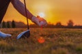 Close up of golfer hand holding golf ball and golf tee Royalty Free Stock Photo