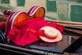 A close up of a gondola with oars, gondolier hat and red blanket in Venice, Italy Royalty Free Stock Photo