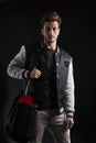 Close up Gorgeous Man in Trendy Fashion Outfit Wearing University Jacket with Sport Bag