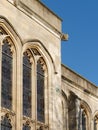 Close-up of Gothic style stained glass windows and Gargoyle.