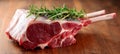 Close-Up of Gourmet Bone-In Ribeye Roast and Top Round Steak Ready for Presentation on Rustic Table Royalty Free Stock Photo