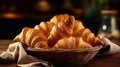 Close up Gourmet Buttery and Flaky Croissant Bread in Vienna Style on a Basket with Cloth on Top of a Table with Dark Royalty Free Stock Photo