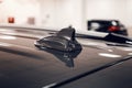 Close-up GPS antenna shark fin shape on a roof of car for radio navigation system Royalty Free Stock Photo