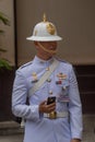 Close-up of Grand Palace guard carrying mobile