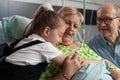 Close-up of granddaughter supporting grandmother hugging her Royalty Free Stock Photo