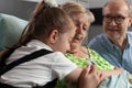 Close-up of granddaughter supporting grandmother hugging her Royalty Free Stock Photo