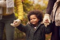 Close Up Of Grandmother And Grandfather Holding Hands With Grandson On Walk In Autumn Countryside Royalty Free Stock Photo