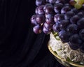 Close up of grape in vase on black Royalty Free Stock Photo