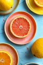 A close up of a grapefruit cut in half on a plate. Generative AI Royalty Free Stock Photo