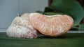 Close-up of a grapefruit that is peeled and the orange pulp is visible Royalty Free Stock Photo