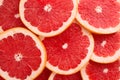 Close-up Grapefruit slices abstract background in Living Coral color Royalty Free Stock Photo