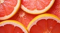 Close-up Grapefruit slices abstract background in Living Coral color of the Year 2019. Generative AI Royalty Free Stock Photo