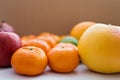 Close-up of grapefruit, tangerines and red apples Royalty Free Stock Photo