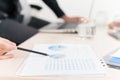 Close-up graph and charts on table during business meeting Royalty Free Stock Photo