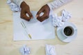 Close-up of graphic designer crumpling paper at his desk